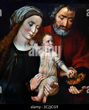 La Sacra famiglia 1525-1530, XVI secolo di Ambrosius Benson Ambrosius Benson (1495/1500-1550) Groeningemuseum, museo municipale, Bruges, Belgio, fiammingo, ( la Sacra famiglia in una scena domestica raffigurante Gesù come bambino tra le braccia di sua madre, Maria. Ha il braccio destro intorno al collo, e con la mano sinistra prende un noce da una ciotola che gli è stata offerta da Joseph. Foto Stock