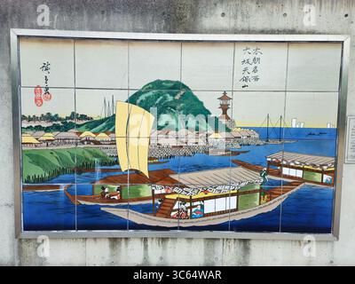 Murale storico delle piastrelle del porto di Tenpozan nel distretto del porto di Osaka, Giappone Foto Stock