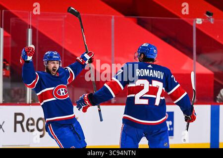 20 marzo 2021: L'ala sinistra dei Montreal Canadiens Tomas Tatar (90) celebra il suo gol con il difensore dei Montreal Canadiens Alexander Romanov (27) durante la partita dei Vancouver Canucks contro i Montreal Canadiens al Bell Centre di Montreal, Quebec. David Kirouac/CSM(immagine di credito: &Copy; David Kirouac/CSM tramite cavo ZUMA) Foto Stock