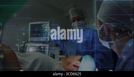 Puntamento del paziente al monitoraggio chirurgo all'interno O con monitor dei segni vitali e sovrapposizione olografica Foto Stock