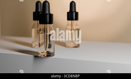 Due flaconi contagocce in vetro trasparente con tappi neri posizionati insieme su una superficie bianca Foto Stock