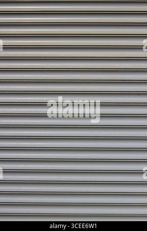 Sfondo in metallo ondulato grigio, dettagli presi Foto Stock