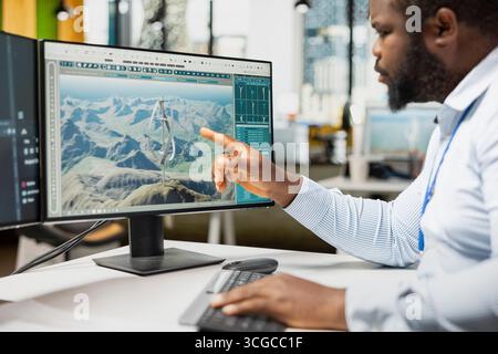 Primo piano sull'analisi di modelli avanzati di turbine eoliche per migliorare l'efficienza e le prestazioni ambientali. Designer crea una turbina VAWT innovativa nel software CAD con una maggiore resa energetica pulita Foto Stock