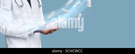 Medico in camice bianco che dimostra farmaci con pillole galleggianti Foto Stock
