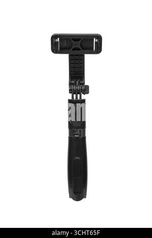 Un elegante mini treppiede ripiegato nero con supporto per telefono. Foto Stock