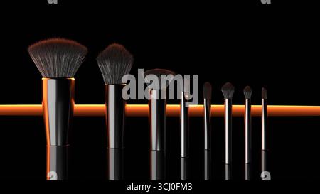 I pennelli per il trucco di diverse dimensioni sono allineati in modo ordinato su una superficie riflettente con un sorprendente sfondo nero e una brillante illuminazione arancione, creando un m Foto Stock