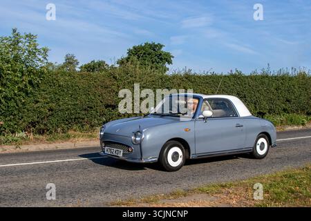 Anni '1991 90 Novanta Nissan Auto Purple Convertible benzina 1000 cc; viaggio a Congleton, Cheshire Classic Car Show, Regno Unito Foto Stock