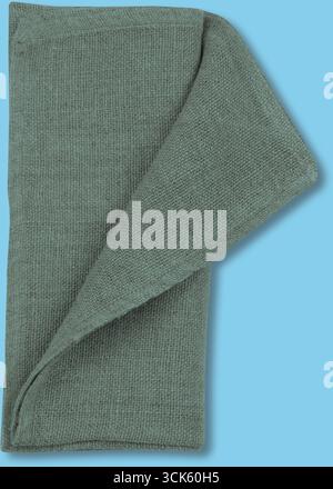 Un asciugamano da cucina piegato di colore verde tenue, adatto per asciugare piatti o mani. Foto Stock