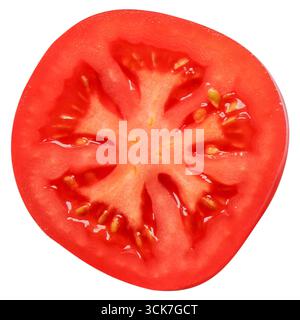 Sezione trasversale di un pomodoro maturo che mostra la polpa succosa e i semi. Foto Stock