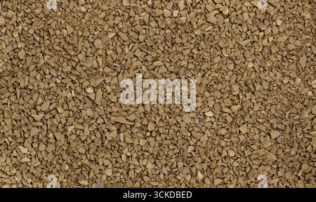 Bevanda a base di caffè istantaneo macchie grosse di caffeina fondo marrone liofilizzato. Foto Stock
