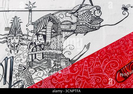 Sud Africa - città del Capo - Street art di Woodstock - intricate linee nere, creature e candele tagliate da una diagonale rossa Foto Stock