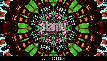 Il motivo intricato sfoggia un effetto caleidoscopio con colori e forme vivaci. Il design include forme geometriche ed elementi floreali disposti in sintonia Foto Stock