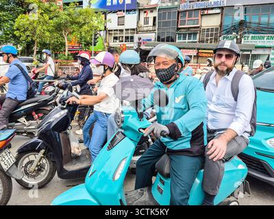 Vietnam, Hanoi, Vinfast moto taxi Foto Stock