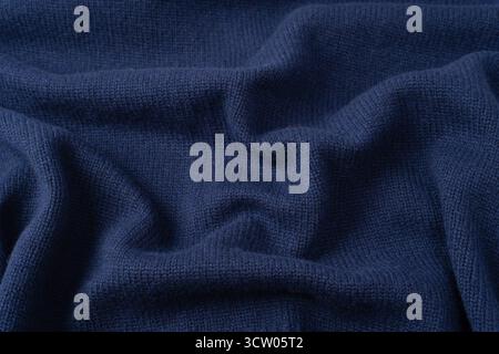 Maglia blu navy in lana merino come sfondo. Vista dall'alto. Foto Stock