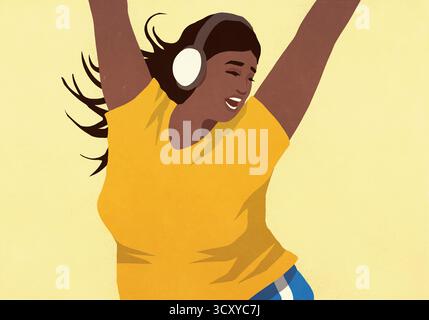 Giovane donna spensierata con cuffie che ascolta musica e balla con le braccia alzate Foto Stock