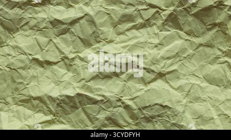 Grana di carta verde arricciata con superficie ruvida primo piano Foto Stock