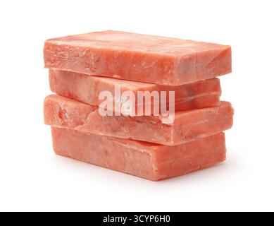 Stack di blocchi di filetto di salmone crudo congelato isolato su bianco Foto Stock