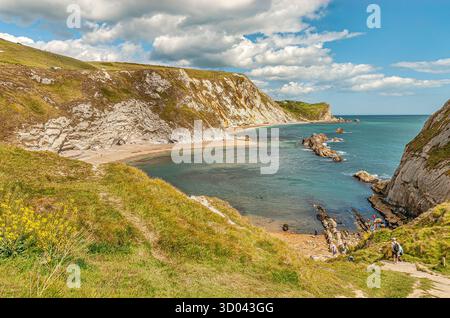 San Oswalds Bay e UOMO O'guerra Cove presso la porta di Durdle Cliff formazione nelle vicinanze Lulworth, Dorset, Sud Inghilterra, Regno Unito Foto Stock