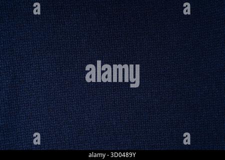 Maglia blu navy in lana merino come sfondo. Vista dall'alto. Foto Stock