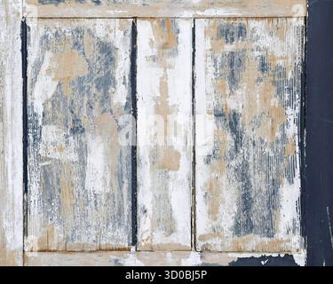 Struttura di fondo di vecchia porta in legno con vernice sbiadita Foto Stock