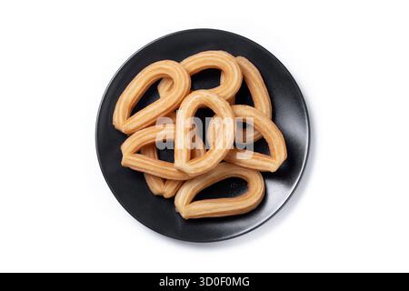 Churros spagnoli tradizionali isolati su sfondo bianco Foto Stock