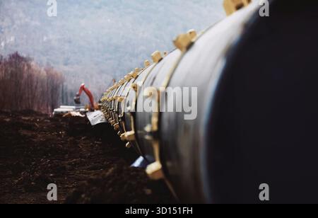 Tubi di un gasdotto, la costruzione e la posa di tubazioni per il trasporto di gas e di petrolio Foto Stock