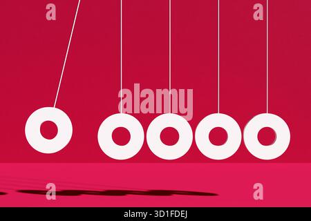 La culla di Newton mostra una reazione a catena di anelli bianchi su sfondo rosso, dimostrando sinergia, energia, reazione a catena e momento Foto Stock