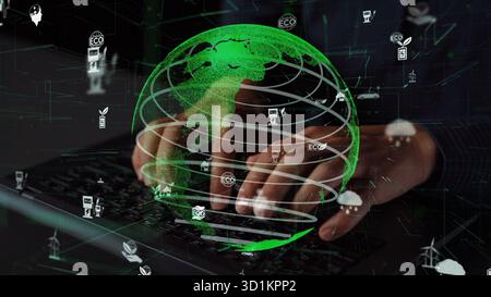 Una composizione visivamente sorprendente che mostra le mani digitate su una tastiera con un globo verde brillante, circondato da icone che rappresentano l'ambiente Foto Stock