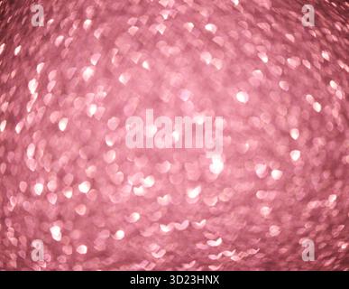 Sfondo bokeh rosa con motivi luminosi a forma di cuore per ambientazioni romantiche e festose. Foto Stock