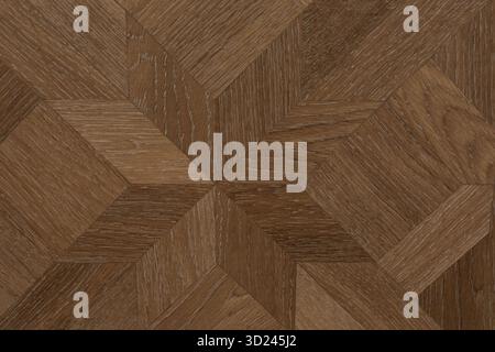 Il pavimento in parquet in legno con motivo geometrico mette in risalto l'artigianalità e lo stile del design della casa Foto Stock