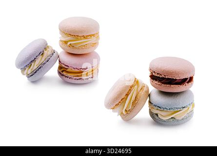 Macaron colorati impilati su una superficie bianca pronti per essere serviti come dessert Foto Stock
