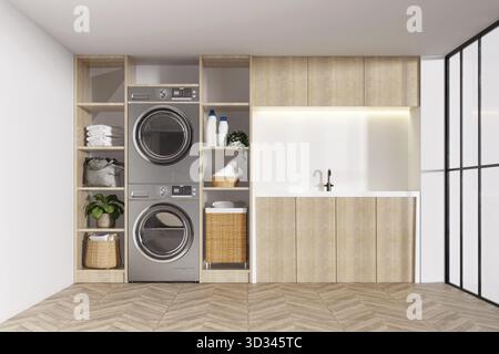 Una lavanderia ben organizzata con lavatrici integrate, unità di stoccaggio e un design elegante per l'efficienza Foto Stock
