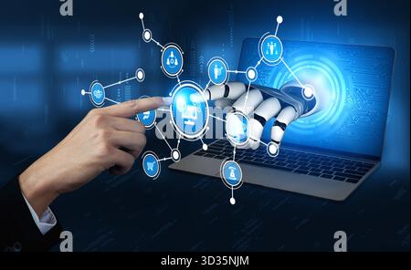 Una mano robotica futuristica interagisce con lo schermo di un computer, illustrando le connessioni digitali e i progressi tecnologici in uno spazio di lavoro moderno Foto Stock