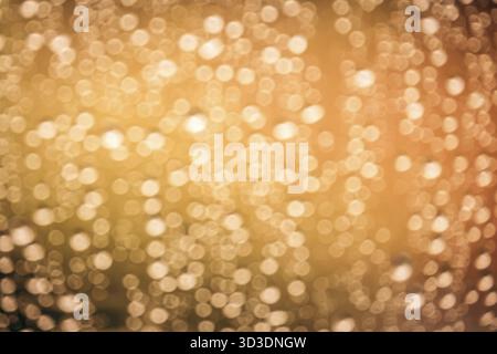 Calde luci di colore arancione bokeh adatti per essere usati come sfondo Foto Stock