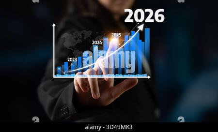 Un professionista aziendale dimostra la crescita finanziaria attraverso la visualizzazione interattiva dei dati, mostrando le tendenze previste per il periodo dal 2023 al 2026 in un moderno Foto Stock