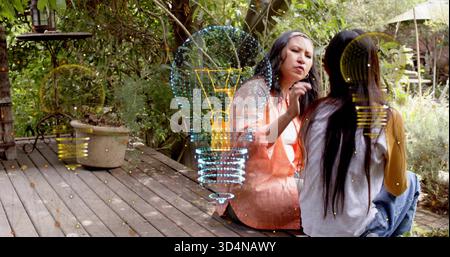 Donna che cura il corpo in camicetta di pesca libera che tocca la compagna sul ponte di legno, con lampadina olografica Foto Stock