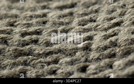 Vista ravvicinata del tessuto intrecciato in tonalità naturali. Foto di alta qualità Foto Stock