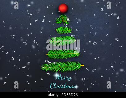 Albero di Natale minimalista realizzato con rami di abete con ornamento rosso e testo "buon Natale" su sfondo scuro e innevato. Foto di alta qualità Foto Stock