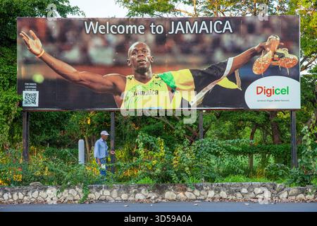 Giamaica, Montego Bay, eroe nazionale Usain Bolt, l'atleta che ha vinto l'oro alle Olimpiadi di Pechino del 2008 accoglie i visitatori all'aeroporto di Montego Foto Stock