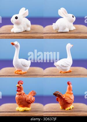 Primo piano di piccole e graziose statuine di animali domestici: Coniglio, oca, gallo, esposte su un podio di legno Foto Stock