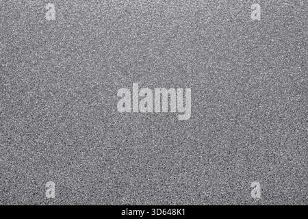 Glitter argentato per una superficie ruvida e scintillante. Sfondo per un design brillante, astratto e metallico Foto Stock