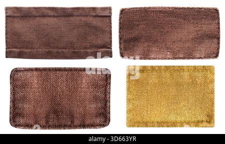 Foto isolata di toppe in tessuto marrone con bordi cuciti su sfondo bianco. Foto Stock