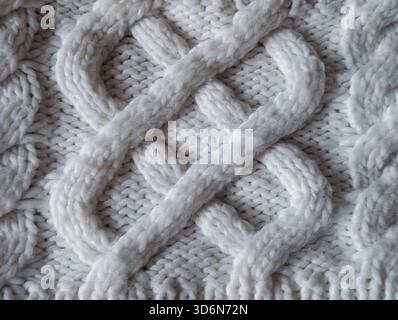 primo piano su tutta la struttura con grossa trama bianca in lana a cavo per un confortevole sfondo invernale Foto Stock