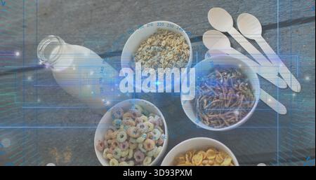 Esposizione di cinque ciotole bianche che contengono cereali su una tavola grigia in legno, con bottiglia di latte e cucchiai Foto Stock