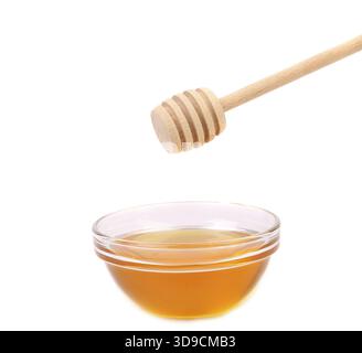 Prua di miele e cucchiaio di legno. Sfondo bianco Foto Stock