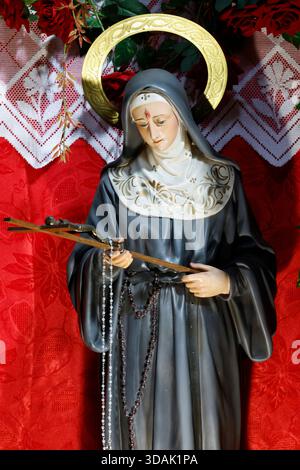 Basilica di Santa Maria in Montesanto. Santa Rita da Cascia è patrona delle vittime di abusi, delle coppie e delle difficoltà matrimoniali, delle vedove e dei malati. Foto Stock