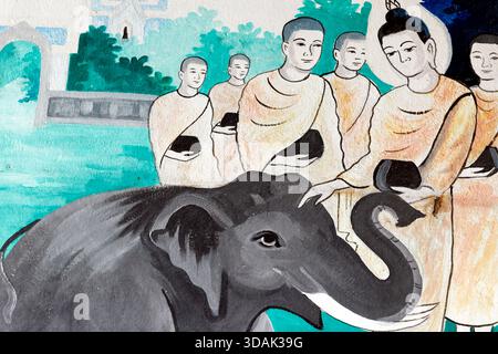 Tempio buddista Wat Manorom. La vita di Buddha, Siddhartha Gautama. Domare un elefante con amorevole gentilezza. Luang Prabang. Laos. Foto Stock