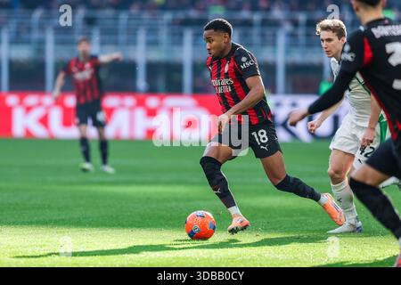 Milano, Italia. 14 dicembre 2025. Christopher Alan Nkunku dell'AC Milan è visto in azione durante la partita di serie A 2025/26 tra l'AC Milan e gli US Sassuolo allo Stadio San Siro. Punteggio finale; AC Milan 2:2 Sassuolo. Credito: SOPA Images Limited/Alamy Live News Foto Stock