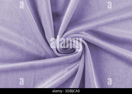 morbide pieghe delicate in velluto viola. Velluto ritorto in una spirale. splendido sfondo. layout per la progettazione. vista dall'alto Foto Stock