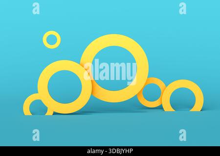 Composizione astratta composta da anelli gialli di diverse dimensioni su sfondo blu, che creano un design moderno e minimalista Foto Stock